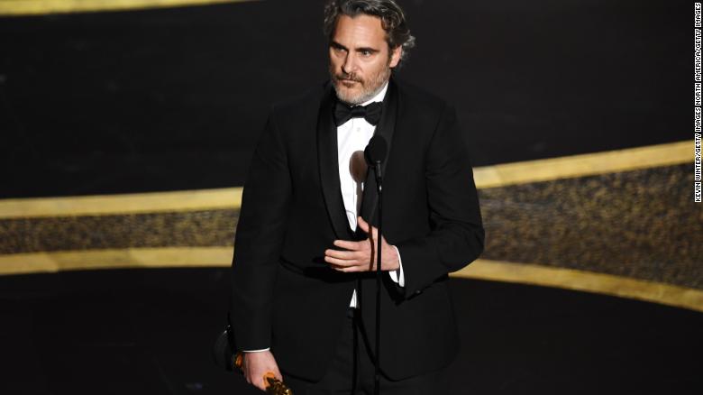 Joaquin Phoenix accepts the Actor In A Leading Role award 